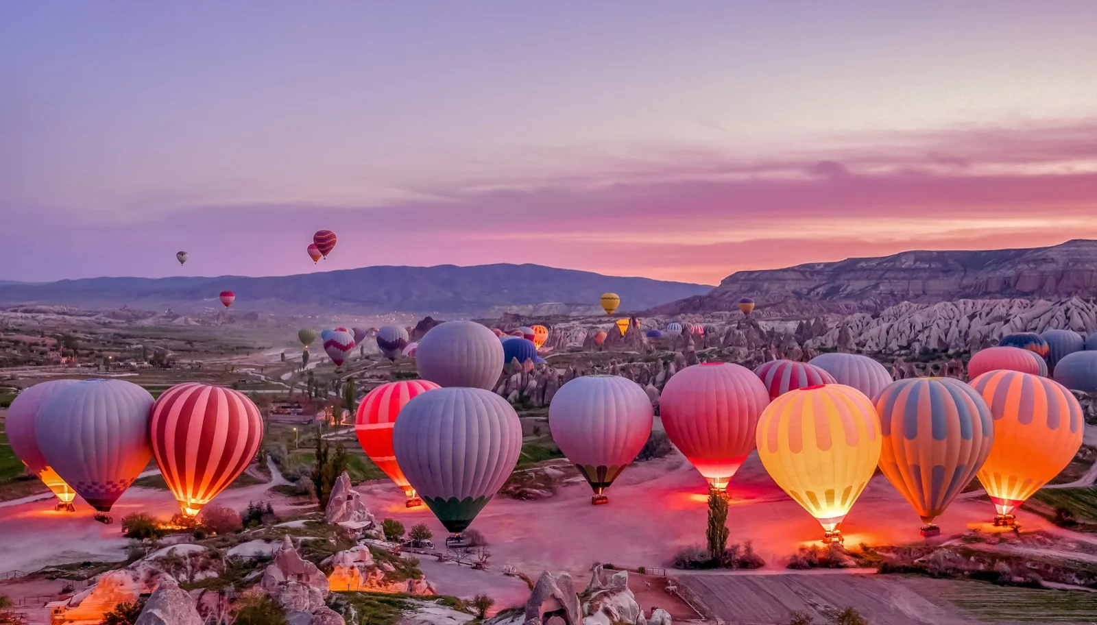 Colorful hot air balloons preparing for launch in Goreme, Cappadocia