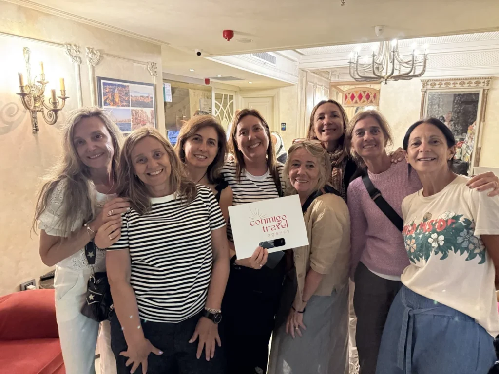 Group of happy guests with Conmigo Travel at hotel