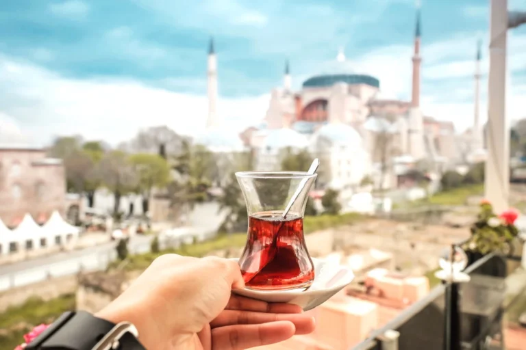 Traveler enjoying Turkish tea with Hagia Sophia view, Istanbul