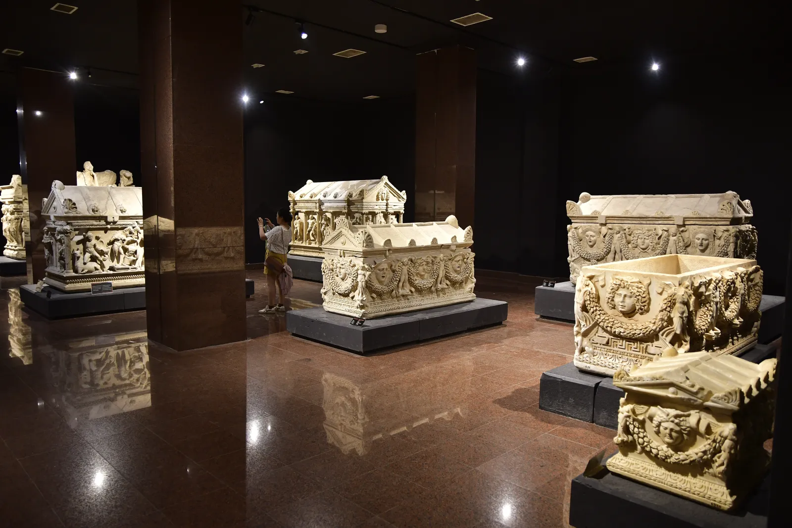 Ornately carved Roman sarcophagi displayed in the Sarcophagi Hall of the Antalya Archaeological Museum