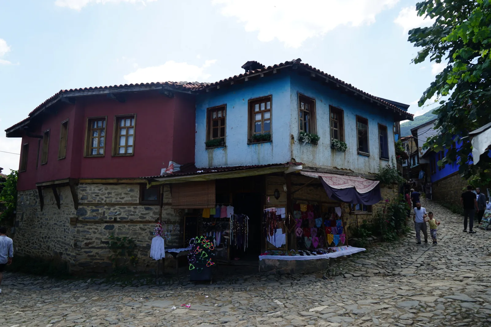 Colorful timber-frame Ottoman houses lining a cobblestone street in Cumalıkızık village