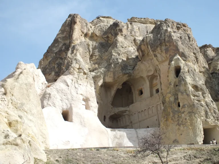 Rock-cut entrance to the Dark Church (Karanlık Kilise) at the Goreme Open Air Museum in Cappadocia