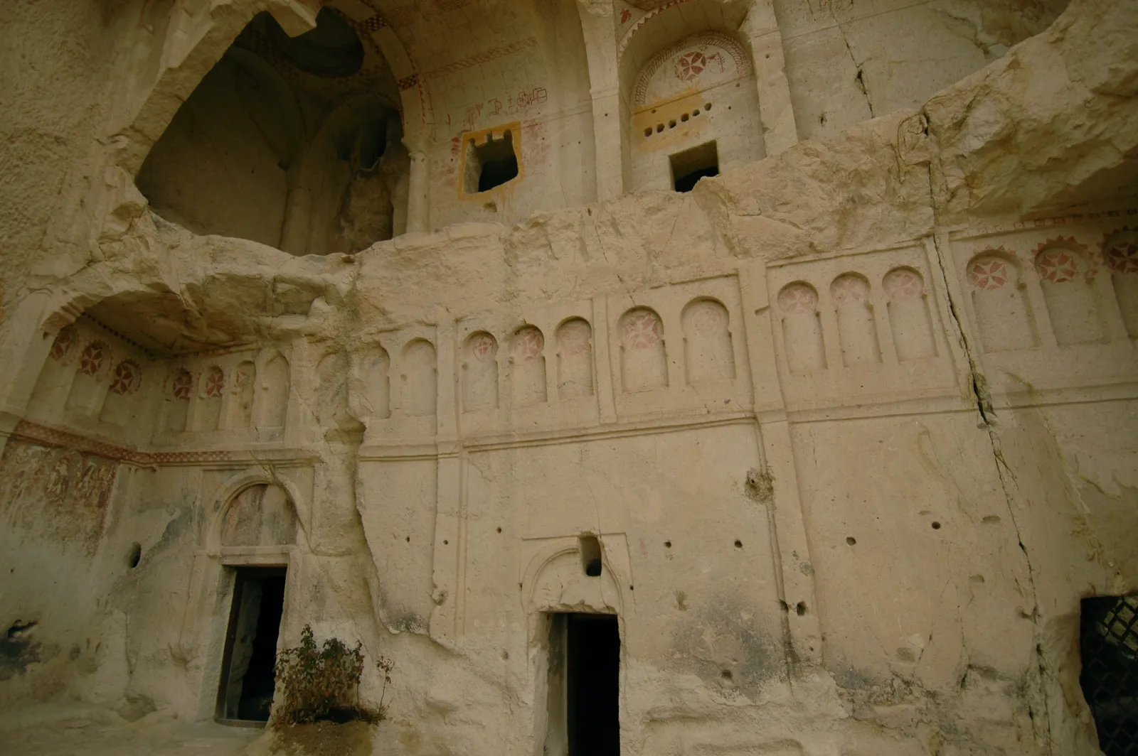 Exterior rock face and entrance area of the Dark Church at the Goreme Open Air Museum