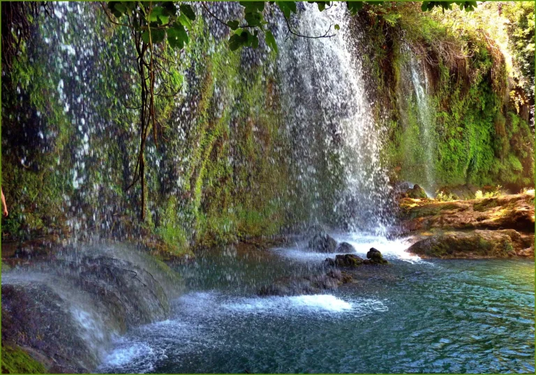 Upper Düden Waterfall cascading into a gorge in Antalya with lush green surroundings