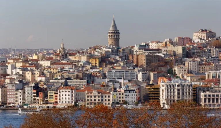 Galata Tower rising above Beyoglu rooftops with the Golden Horn waterfront