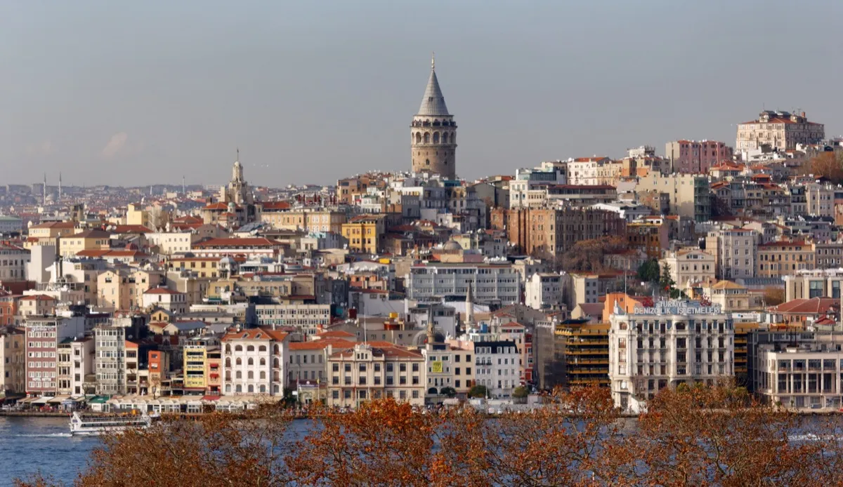 Galata Tower rising above Beyoglu rooftops with the Golden Horn waterfront
