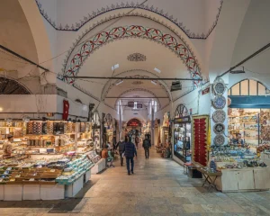 Interior corridor of the Grand Bazaar Istanbul with vaulted stone ceilings and rows of shops