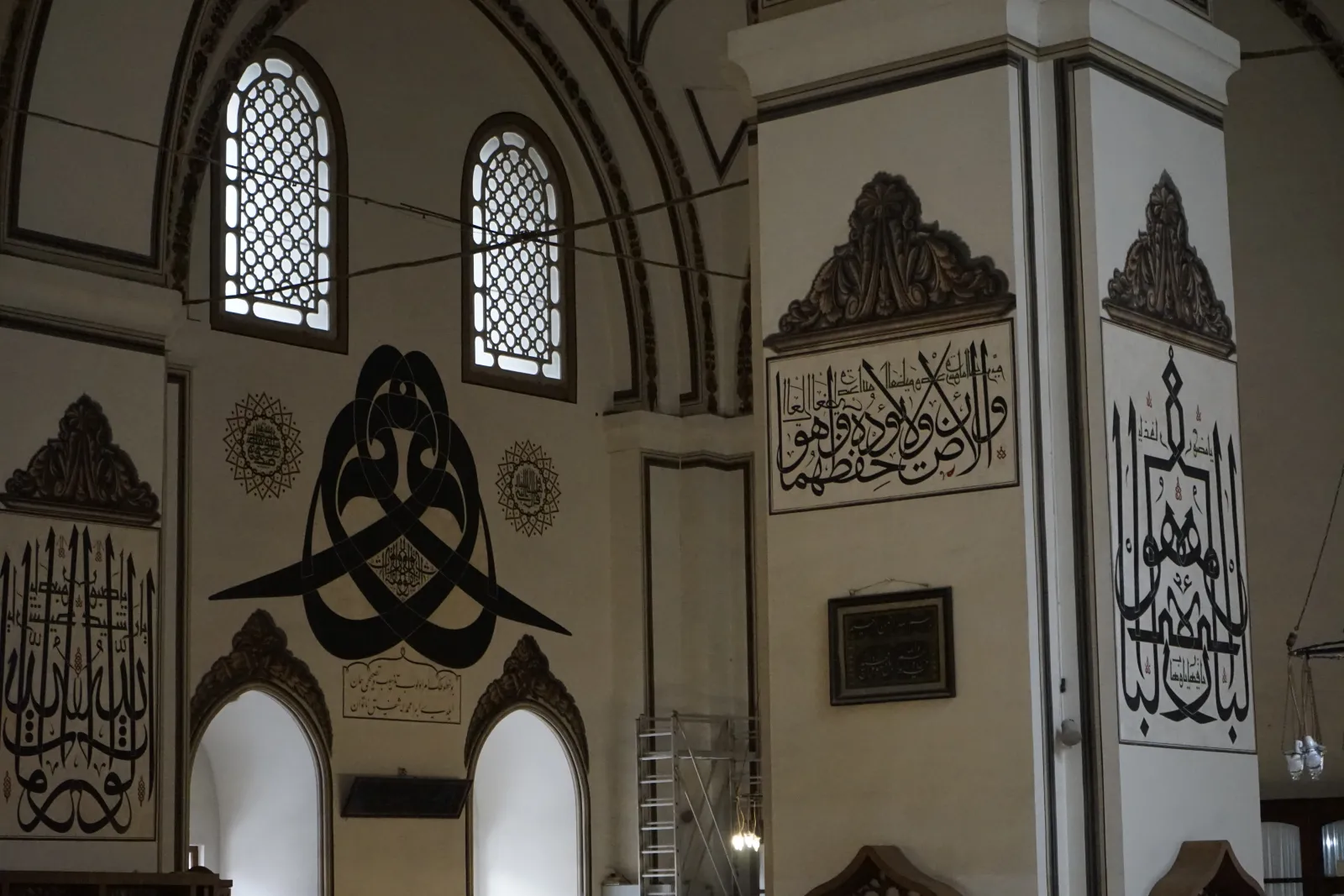 Detailed Ottoman calligraphy panels on the walls of the Grand Mosque Bursa