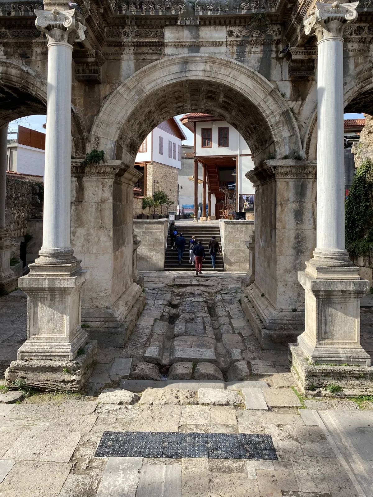 Detail view of Hadrian's Gate in Antalya showing the carved Corinthian columns and arches