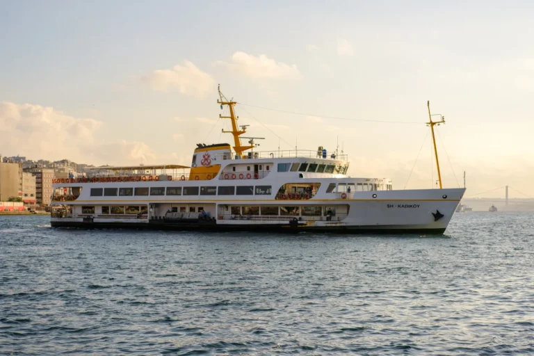 A ferry crossing the Bosphorus from Eminonu to Kadikoy with Istanbul skyline behind