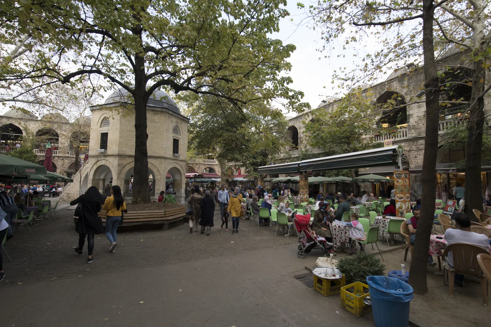 The small central mosque of Koza Han Bursa elevated on pillars above the fountain in the courtyard