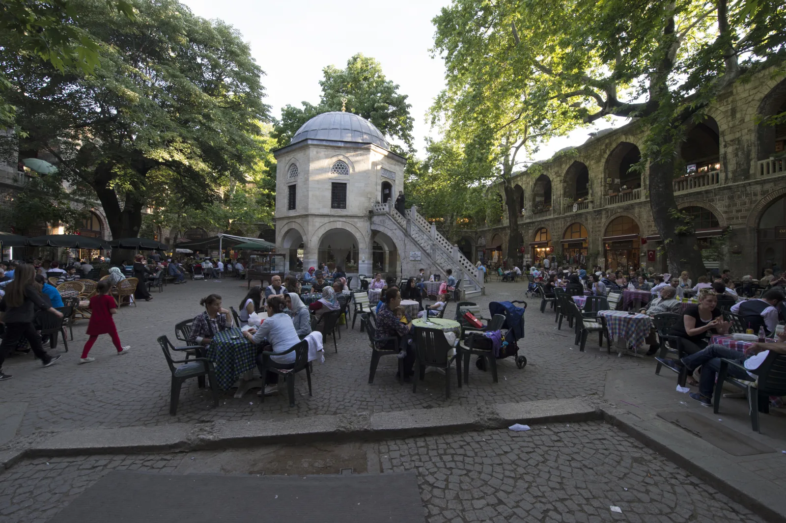 Colorful Turkish silk scarves and textiles displayed in a Koza Han shop