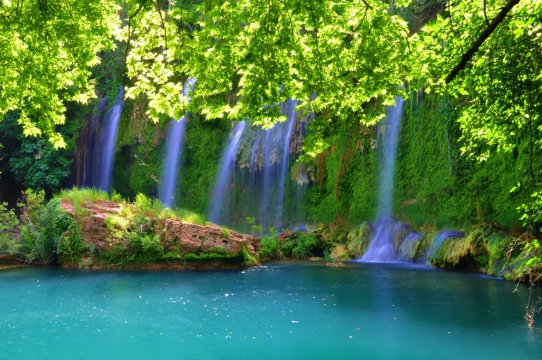 Kursunlu Waterfall cascading 18 meters into a natural pool surrounded by pine forest