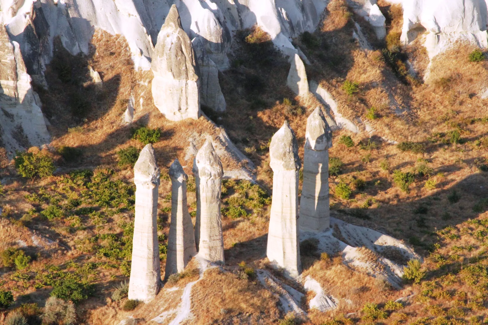 The hiking trail winding between tall fairy chimney columns in Love Valley Cappadocia