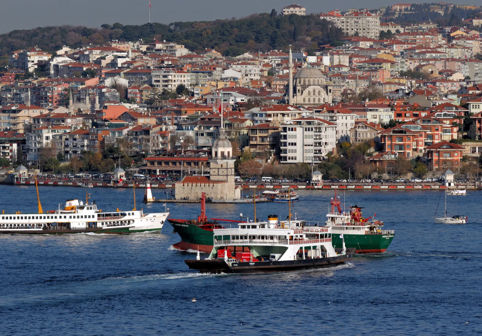 Maiden's Tower seen from the Salacak waterfront in Üsküdar with the European Istanbul skyline behind