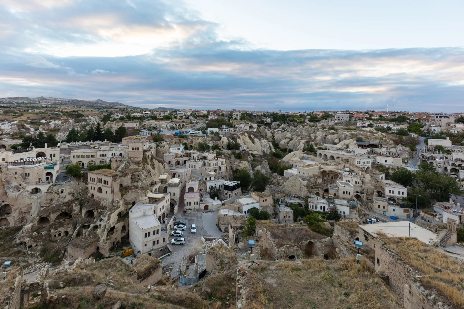 Traditional stone houses and narrow streets in Ortahisar village below the castle rock in Cappadocia