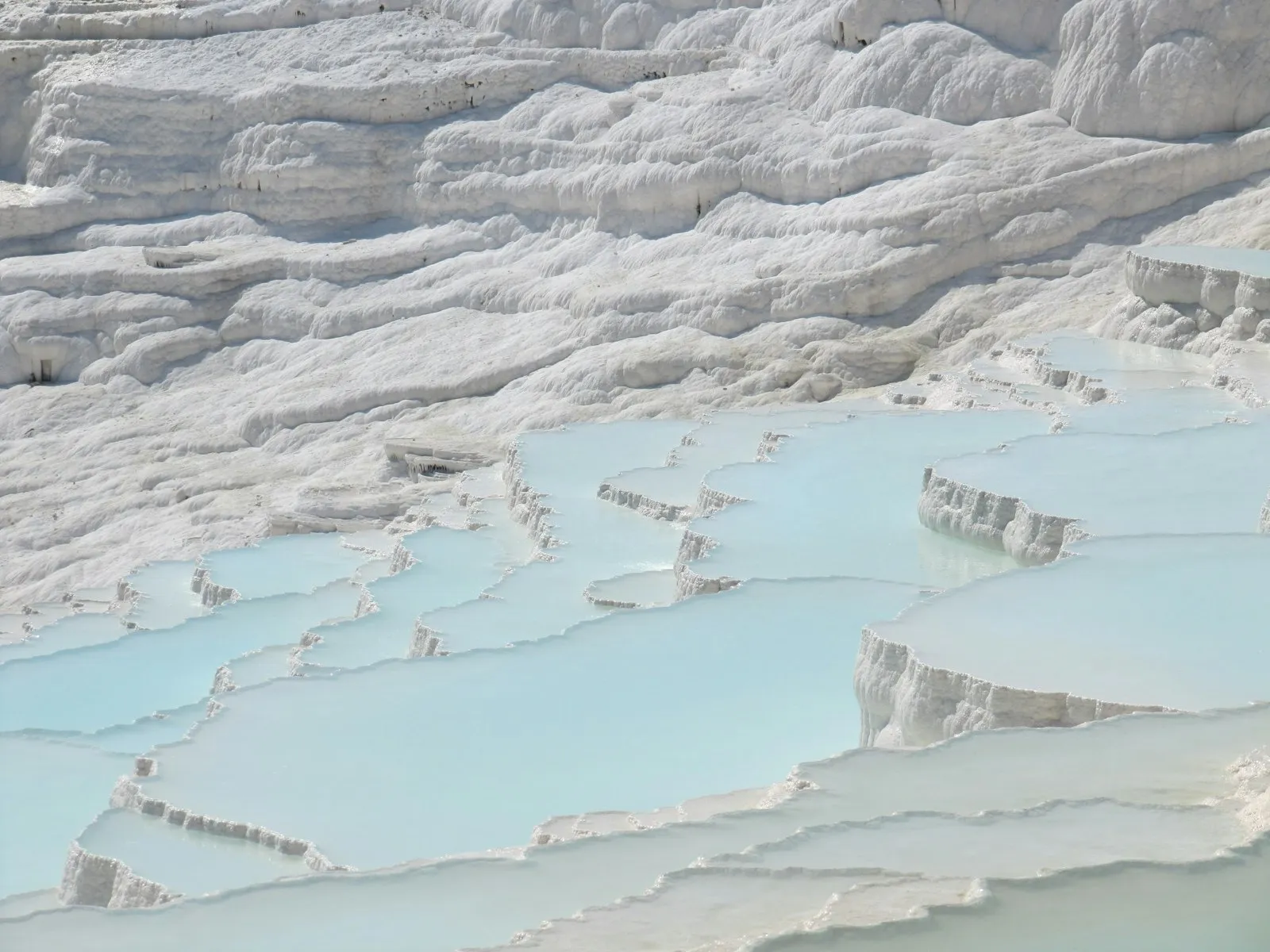 Pamukkale white travertine terraces with thermal pools