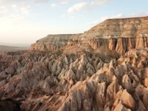 Sunset over Red Valley in Cappadocia with the rock formations glowing in warm light