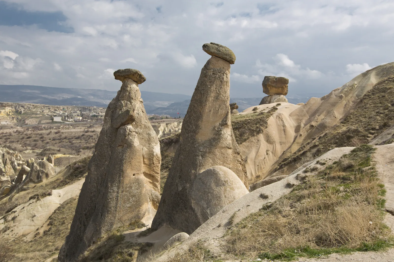 Side view of the Three Beauties fairy chimneys in Cappadocia with basalt caps protecting tuff columns